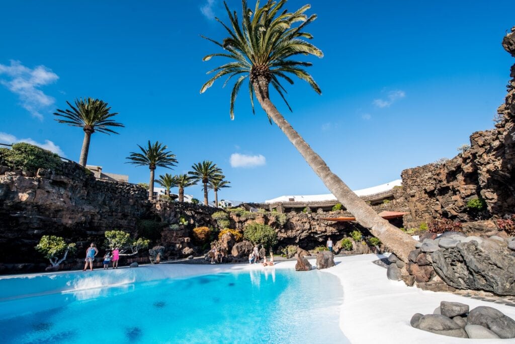 The white pool of Jameos del Agua surrounded by volcanic rock