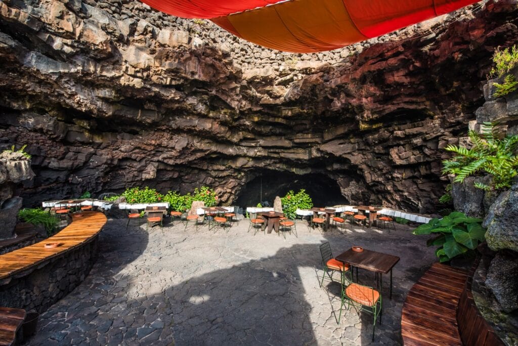 Tables of the restaurant inside the cave at Jameos del Agua